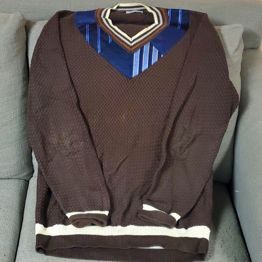 Brown and cream with blue sweater